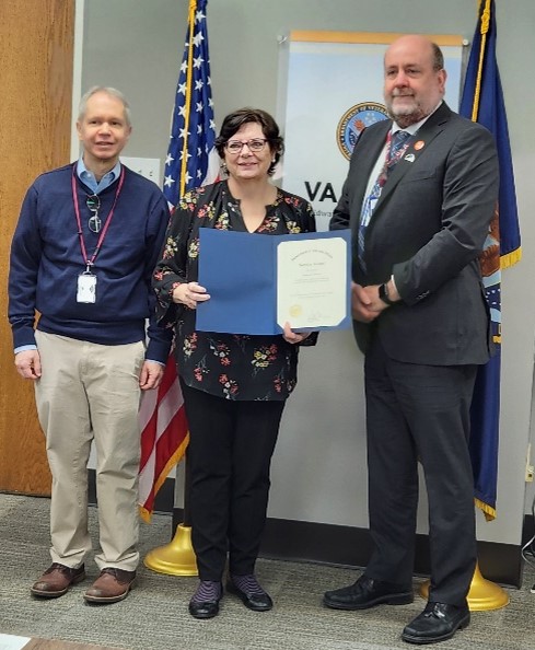 Image of Dr. Weaver receiving a certificate